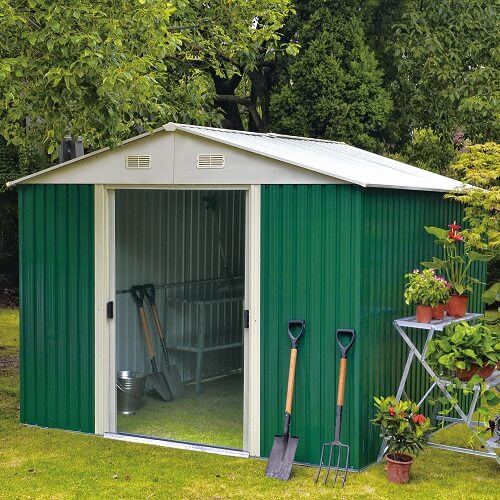 A garden shed in green in the forest