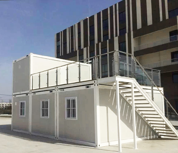 Designed container house with stairs under the blue sky